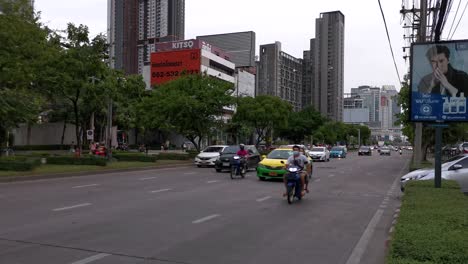 4k vehicle traffic commuting along ratchadaphisek road in bangkok, thailand.