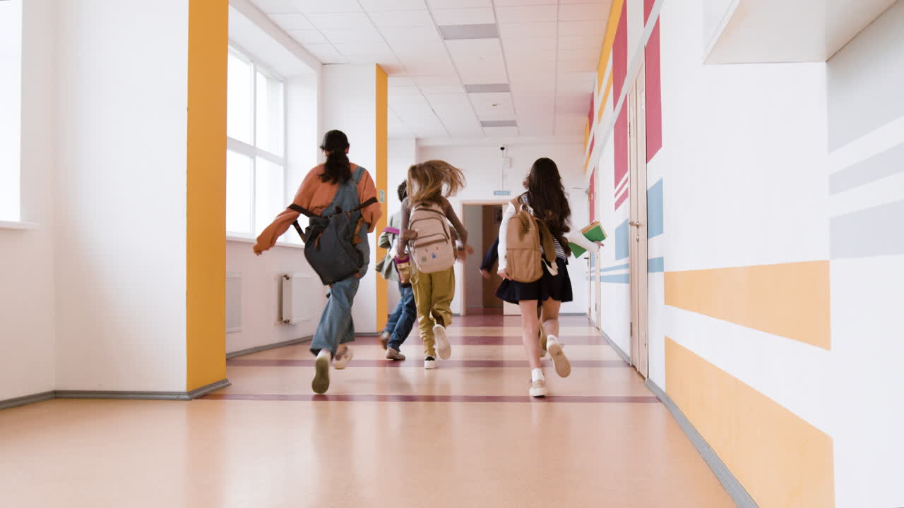 Students Running Down a School Hallway