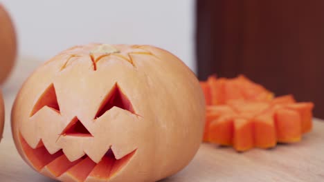 Carved-pumpkin-heads-ready-for-Halloween--close-up-pan