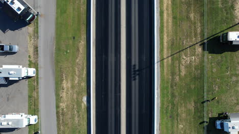 downward angle drone shot of drag strip race track