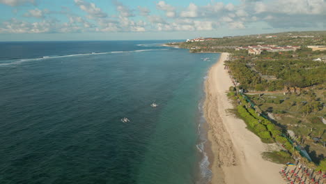 waves wash upon nusa dua beach bali indonesia morning drone track left 4k 60fps