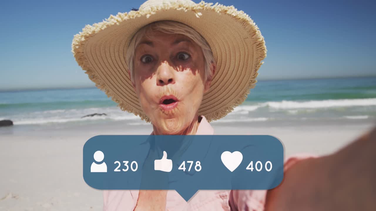 Animación de personas, íconos de me gusta y corazón con números sobre una mujer mayor con sombrero de paja en la playa