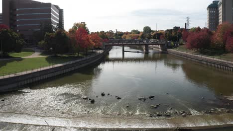 flint river with dam and drone video moving forward over river with a low shot