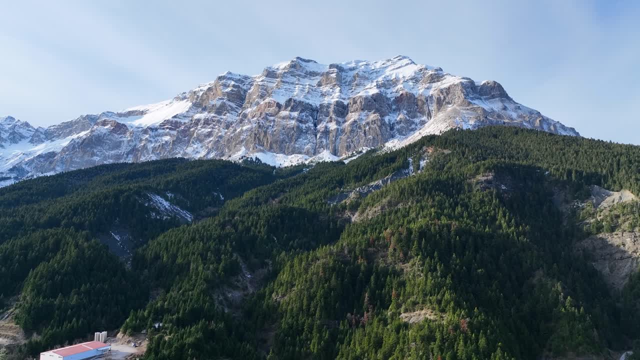 Aerial footage of mountain with snow