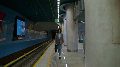 woman walking through a subway station