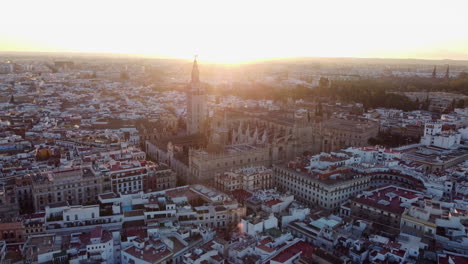 epic aerial view of the cathedral of seville, largest gothic cathedral in the world at sunset time