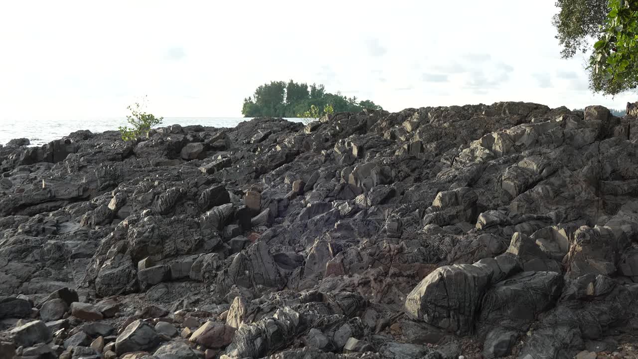 Summer At Pasir Pandak With Beautiful White Sandy Beach During Sunset Facing Wide Open Sea surrounded with Rock And Green Trees,Sarawak,Borneo.