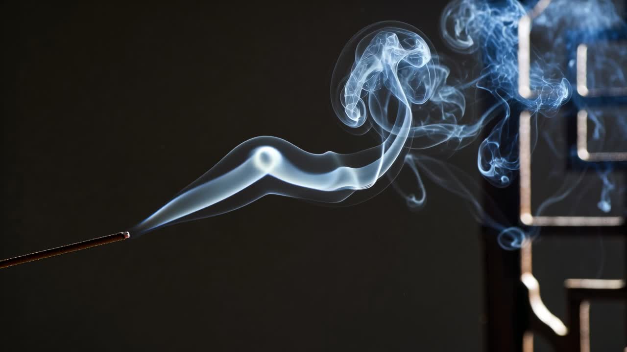 Emitting smoke plume from lit incense stick in studio moving toward metal panel, forming vortices
