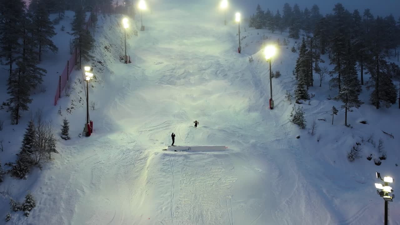 Epic 4K cinematic drone shot of a skier launching off an ice ramp in Ruka, Finland, framed by sweeping Nordic landscapes_43