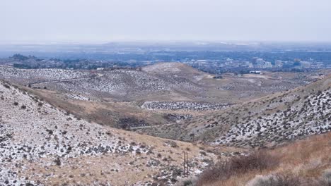 panoramic view of boise city from snow covered mountains during crisp, cold wintery fall season day in boise, idaho, usa