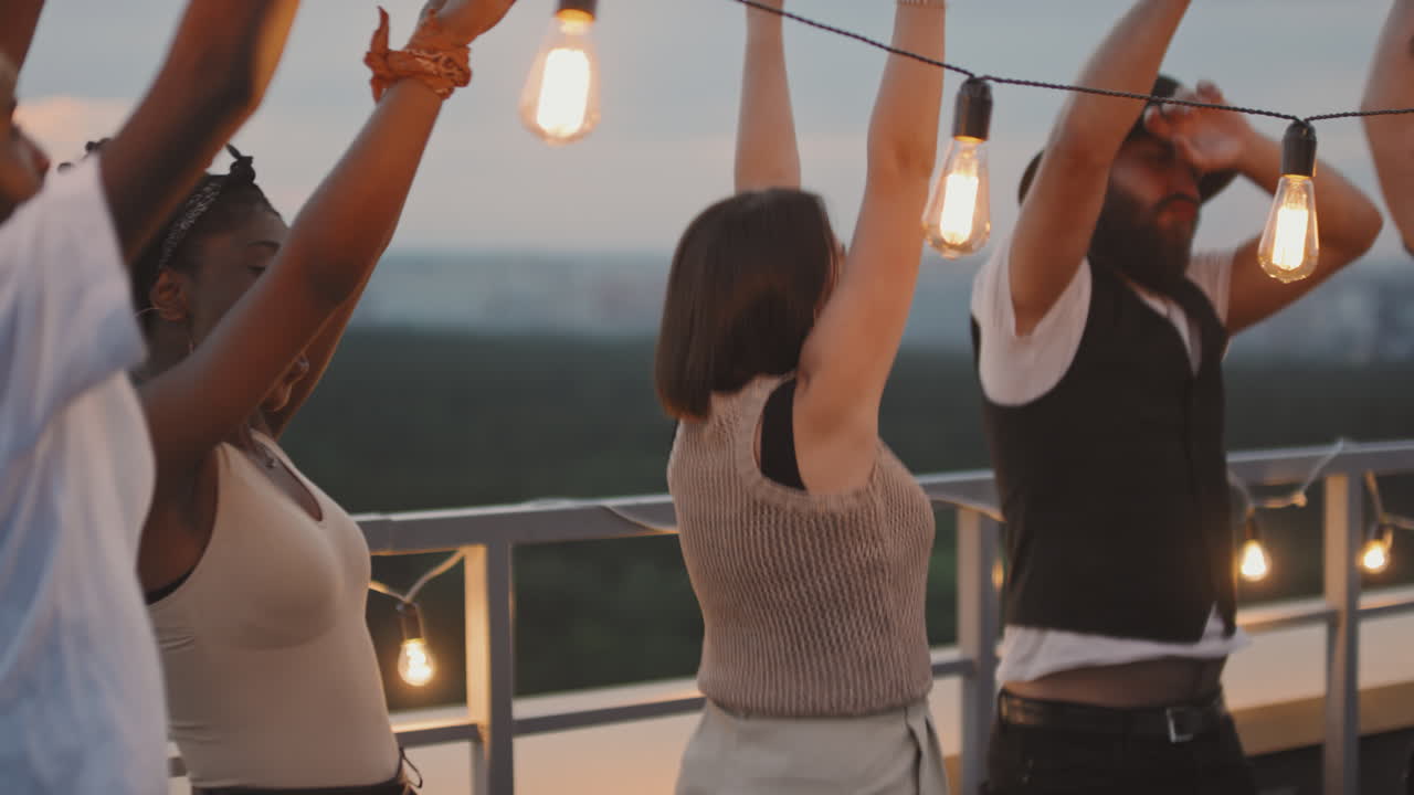 Group of Friends Dancing on Rooftop
