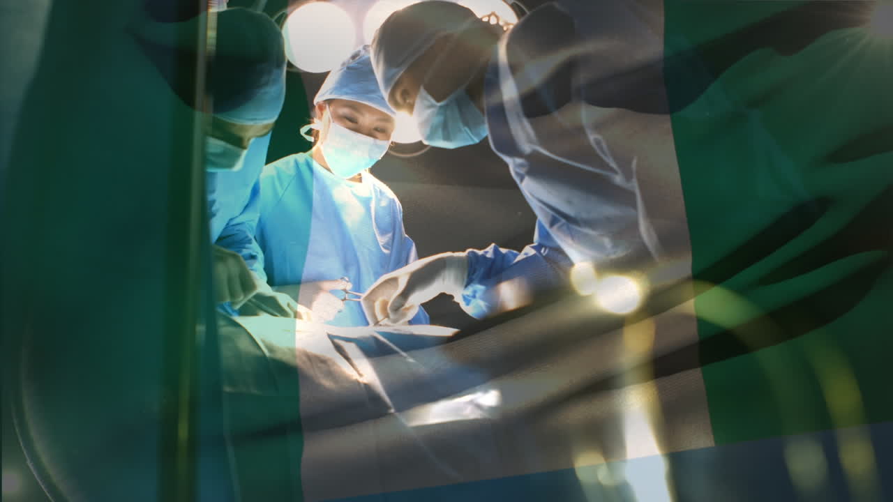 animación de la bandera de nigeria ondeando sobre los cirujanos en el quirófano