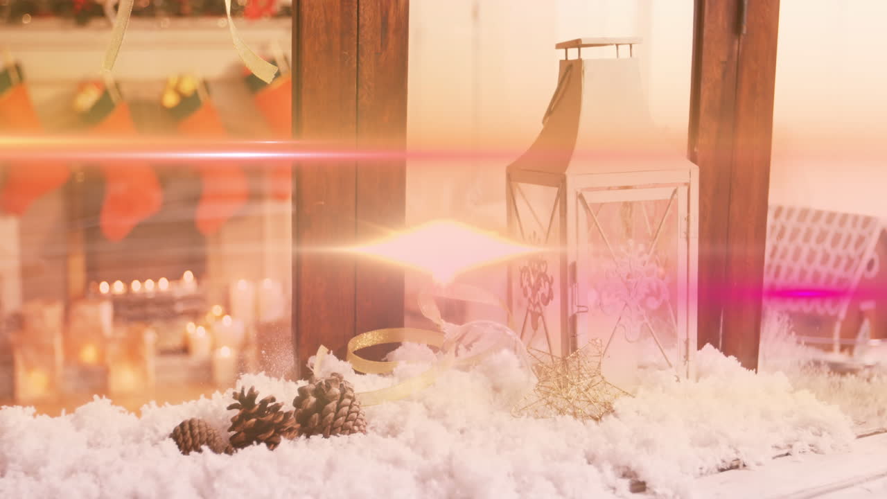 Animation of glowing lights moving over fir tree cones and lantern christmas decorations