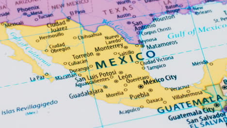 close-up of the country word mexico on a world map with the detailed name of the capital city