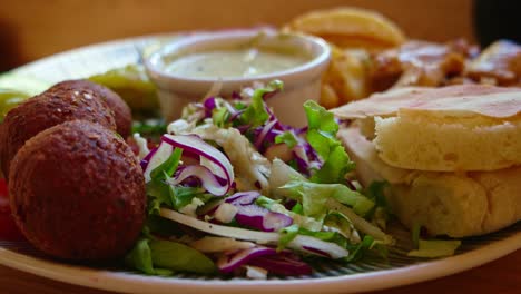 time-lapse of eating plate full of israeli food - felafel pita and soon