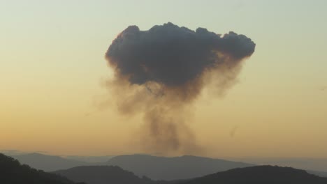 dark smoke cloud from a fire in the sky