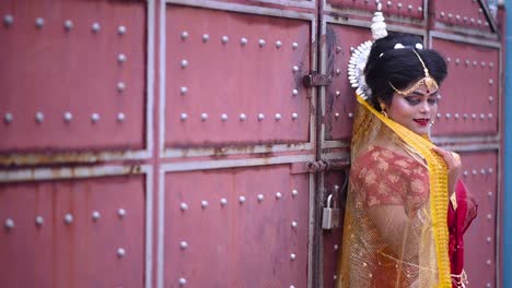 beautiful indian bengali bride smiles at camera