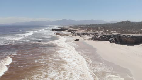 AERIAL:-Garden-Route-Coast-of-South-Africas-Western-Cape-with-red-algae-in-water