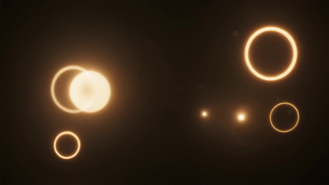 Abstract Golden Glowing Circles Floating on Dark Background