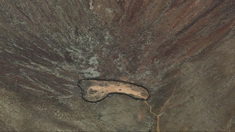 Cinder-cone-base-of-Bayuyo-Volcano-with-eroded-slopes-to-the-center-with-orange-trail