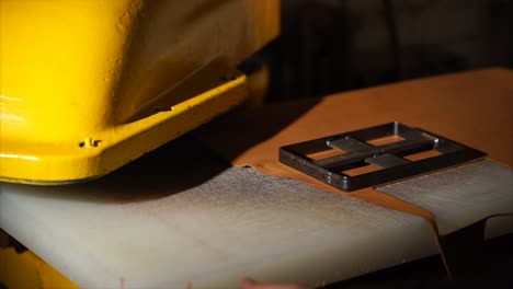 leatherworking process with stamping machine