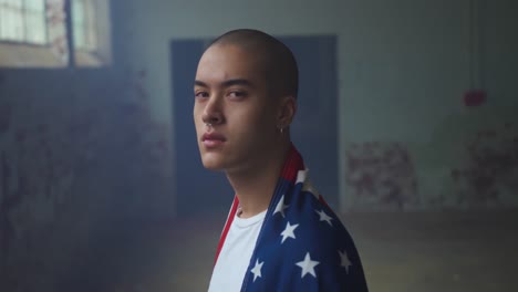 fashionable young man in an abandoned warehouse