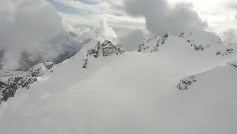 Incredible-aerial-view-of-a-glacier-in-the-deep-mountains-of-British-Columbia,-Canada