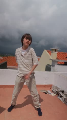 child dancing on a rooftop