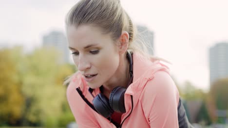 Handheld-view-of-woman-catching-a-short-break-during-jogging