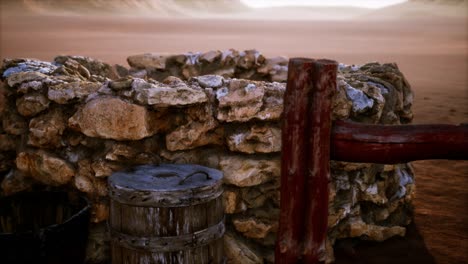 old stone water well in the desert