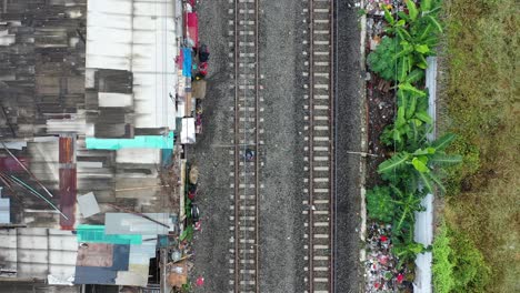 aerial view of slums and train tracks