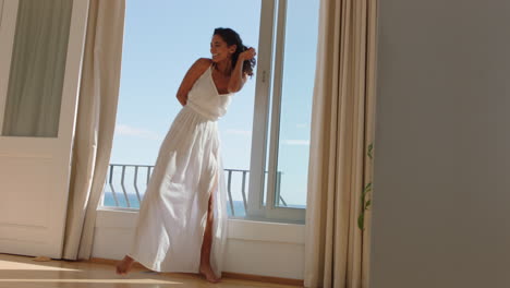 travel-woman-dancing-in-hotel-room-having-fun-celebrating-summer-vacation-enjoying-carefree-holiday-lifestyle