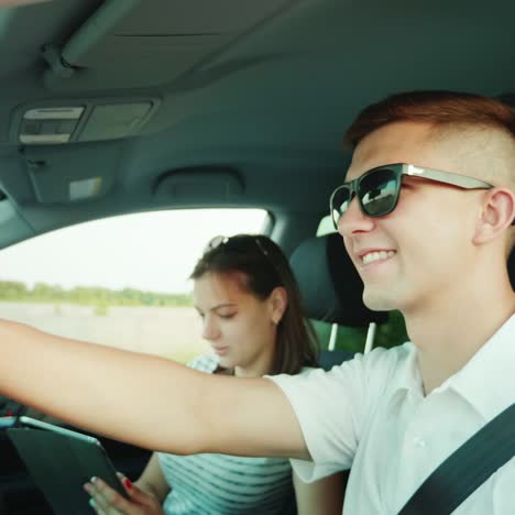 a young couple is traveling by car 1