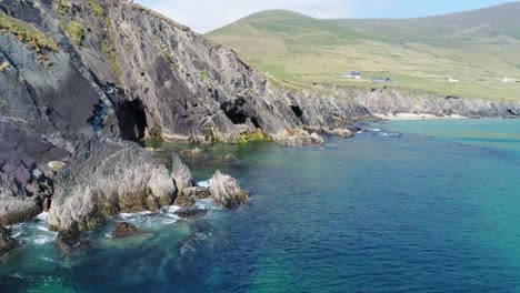 A-drone-shot-of-the-rugged-coastal-terrain-of-the-Dingle-Peninsula,-near-Dingle-Point,-in-Ireland