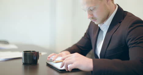 business attractive business man using digital tablet