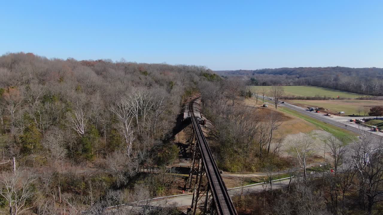 Aerial Shot Pushing Towards the End of the Pope Lick Railroad Trestle in Louisville Kentucky on a Sunny Afternoon