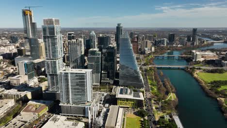 aerial shot of downtown austin, tx with the colorado river in frame