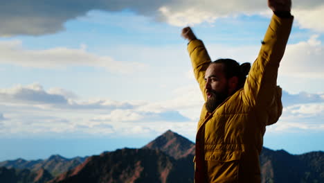 proud explorer reaches the top of the mountain feeling satisfied