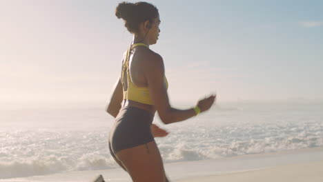 fit, active and sporty jogger running at sunset