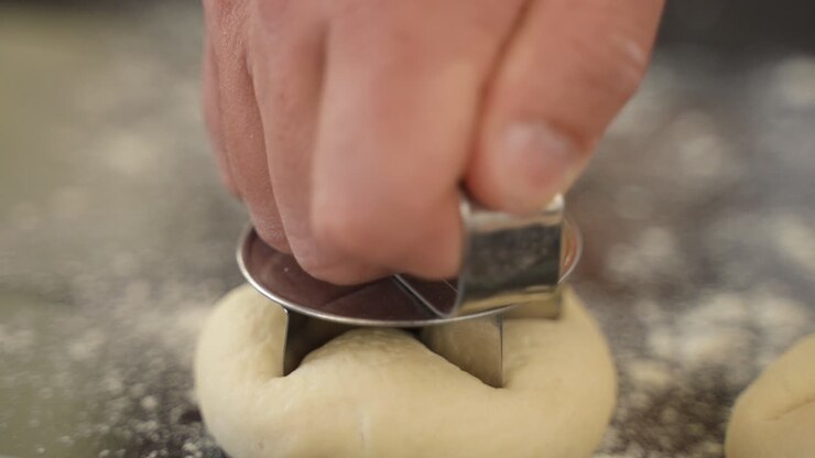 Baker Making Kaiser Roll Buns from Dough, Close Up on Hands in Slow Motion
