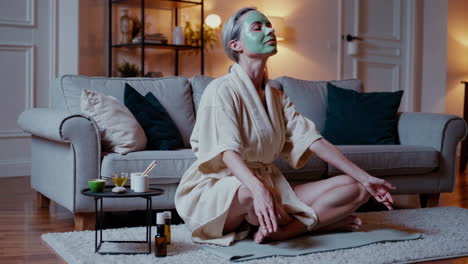 woman with face mask relaxing and meditating at home