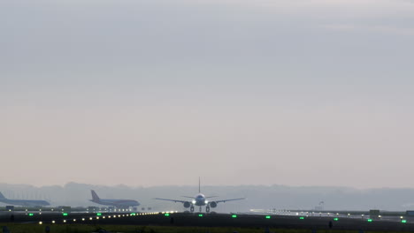 airplanes landing/taking off in misty conditions