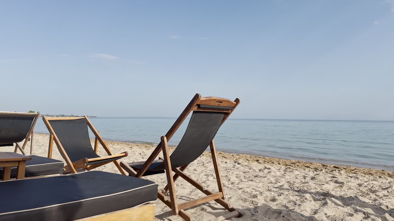 Sunbed on the clean blue flag beach club of Halkidiki Peninsula, Greece