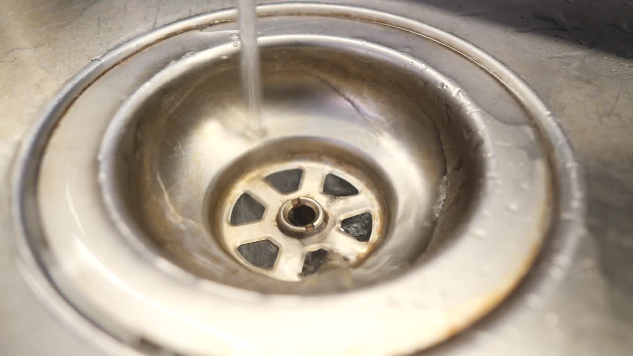 Water Draining into Sink Drain