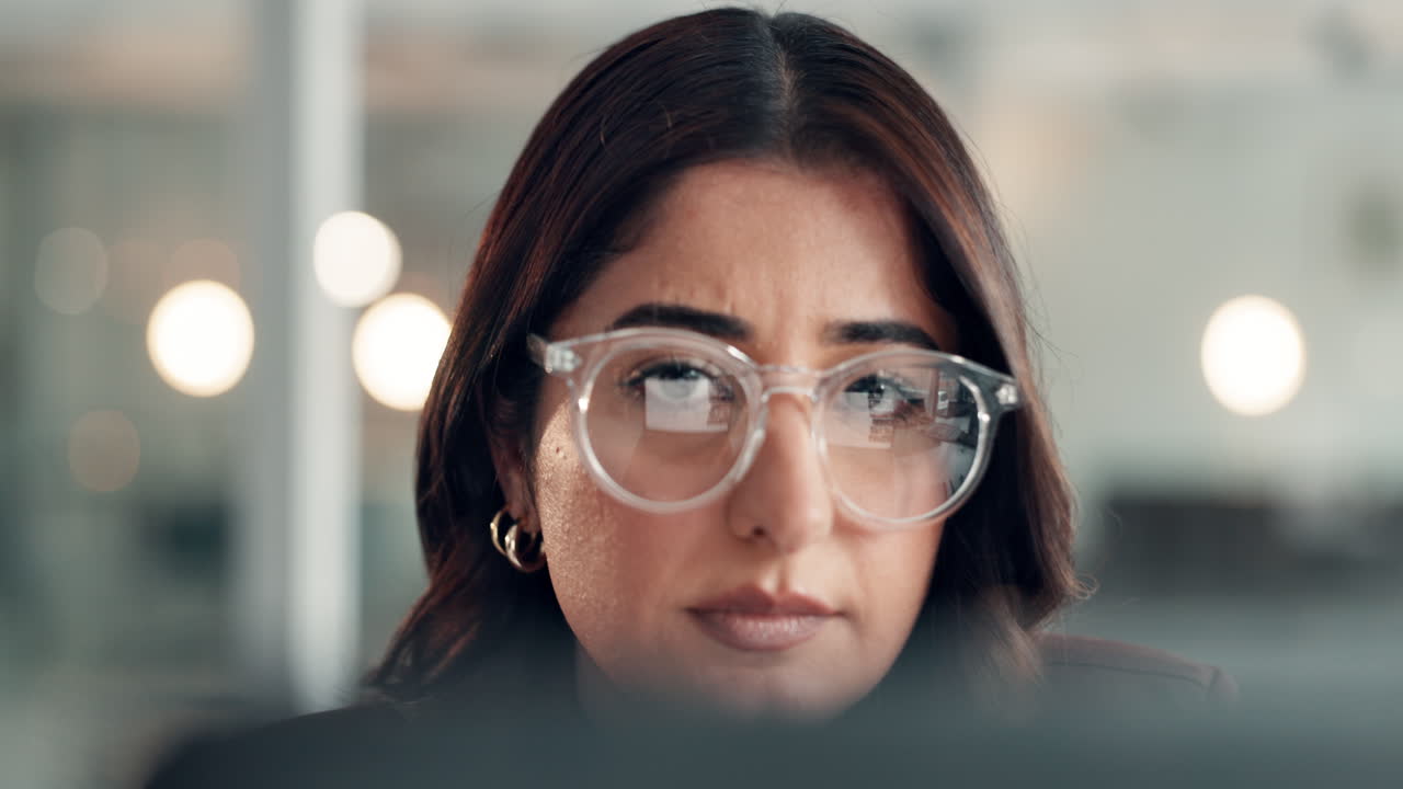 Business woman wearing glasses in office setting