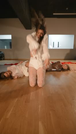 contemporary dance performance with red ribbons