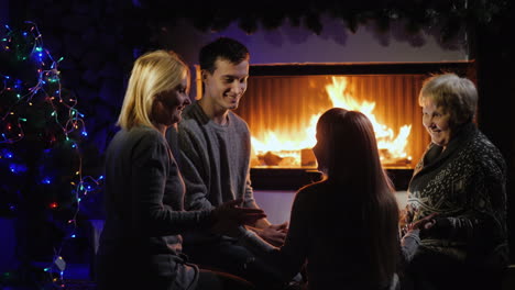 cheerful family plays by the fireplace have a good time together