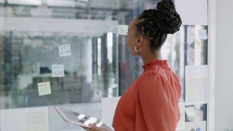 a young businesswoman using a digital tablet