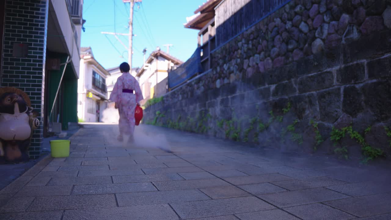 Japanese Women in Yukata Walking Through Geothermal Street, Beppu