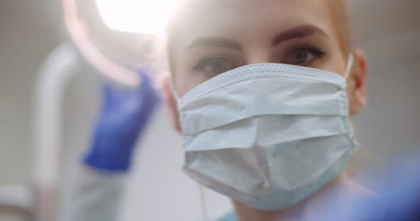 surgeon's face operating the patient on an operating table